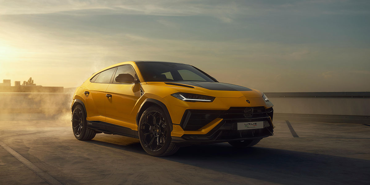 Yellow Lamborghini Urus parked on a rooftop at sunset, showcasing its sporty design and sleek lines.